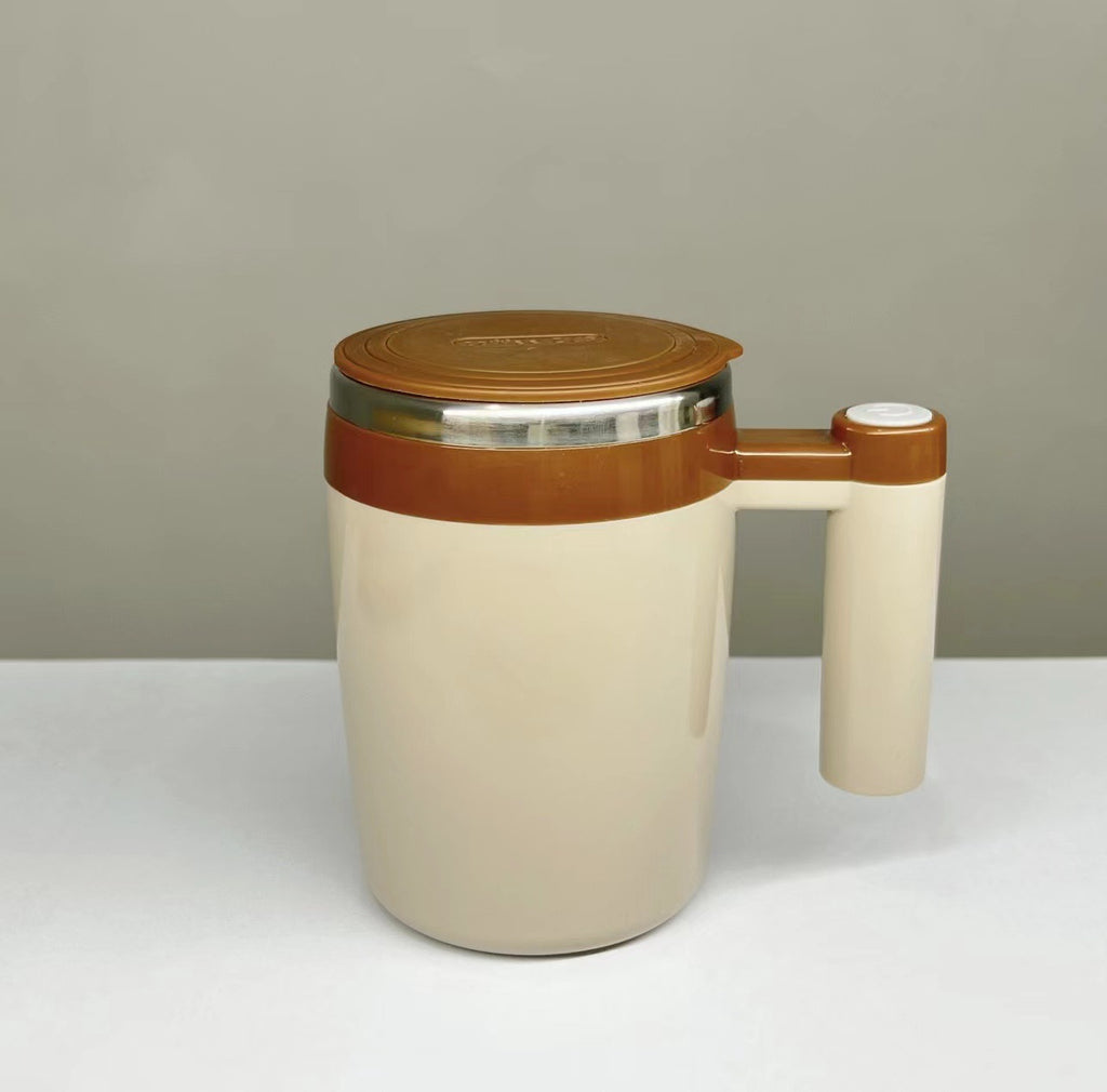 Le Monde Tech beige and brown vitamix blending cup with handle and lid on white surface